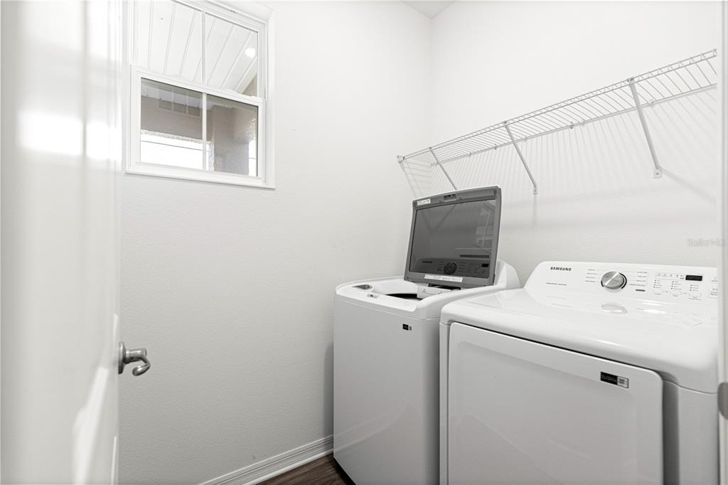 10242 Southwest 99th Lane Ocala, FL 34481 - Photo 41 of 51 a view of storage and utility room with washer and dryer