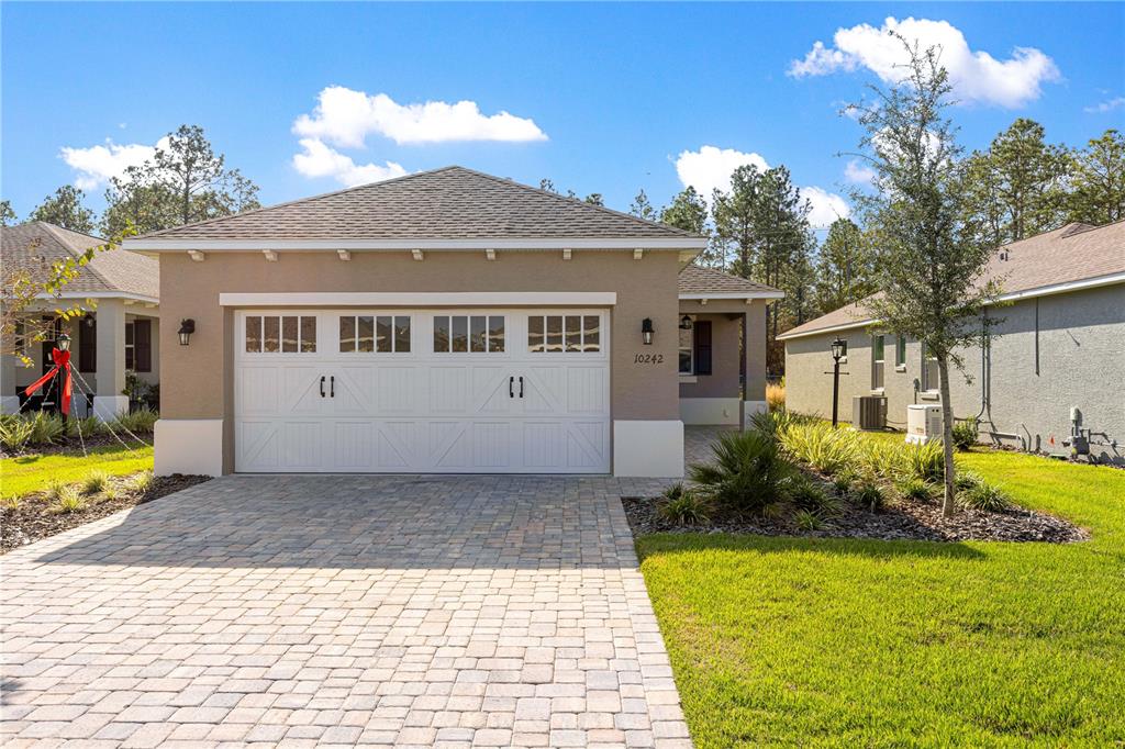 10242 Southwest 99th Lane Ocala, FL 34481 - Photo 5 of 51 a view of a house with a yard
