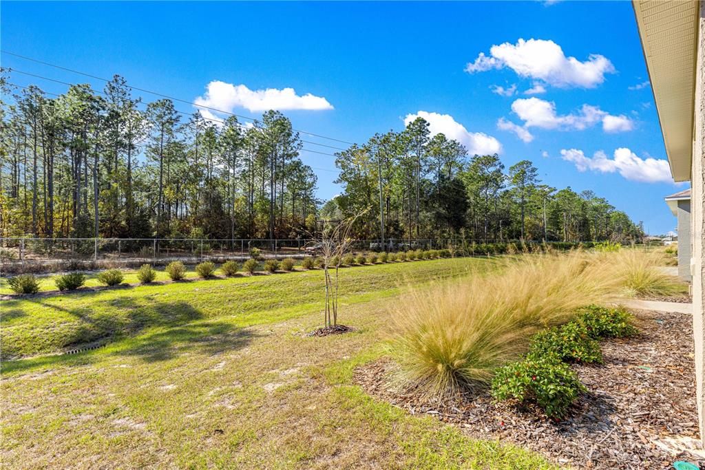 10242 Southwest 99th Lane Ocala, FL 34481 - Photo 51 of 51 a view of a swimming pool with an outdoor space and seating area