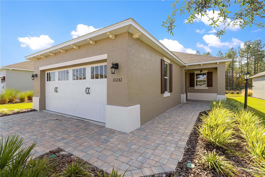 10242 Southwest 99th Lane Ocala, FL 34481 - Photo 6 of 51 a view of a house with a outdoor space