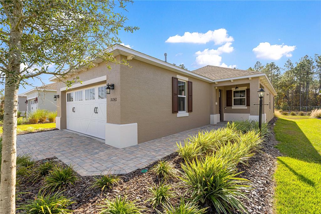 10242 Southwest 99th Lane Ocala, FL 34481 - Photo 10 of 51 a view of a house with a patio