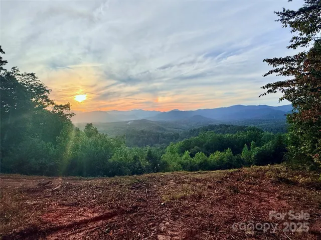 a view of a town with mountains in the background