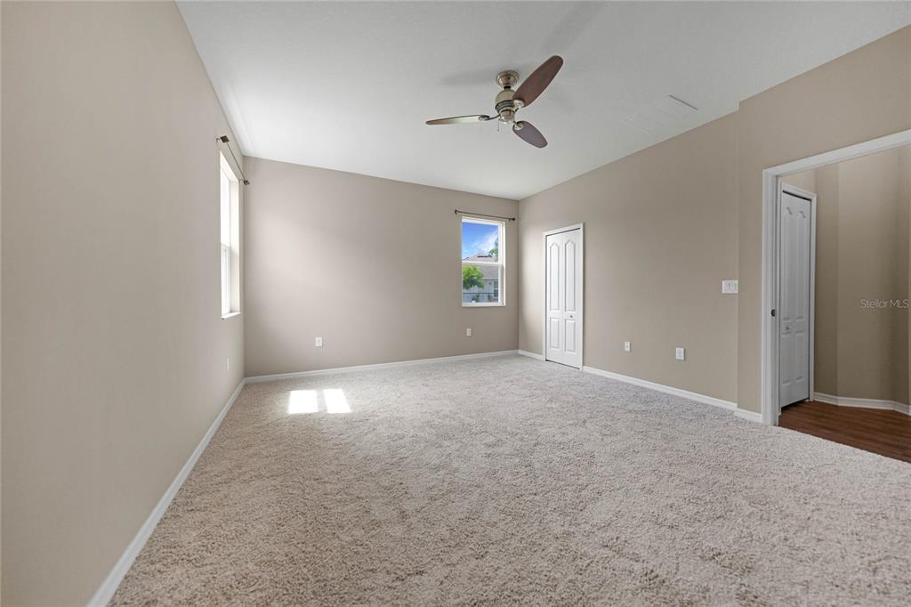 10147 Winding River Road Punta Gorda, FL 33950 - Photo 14 of 33 a view of a livingroom with a ceiling fan and window