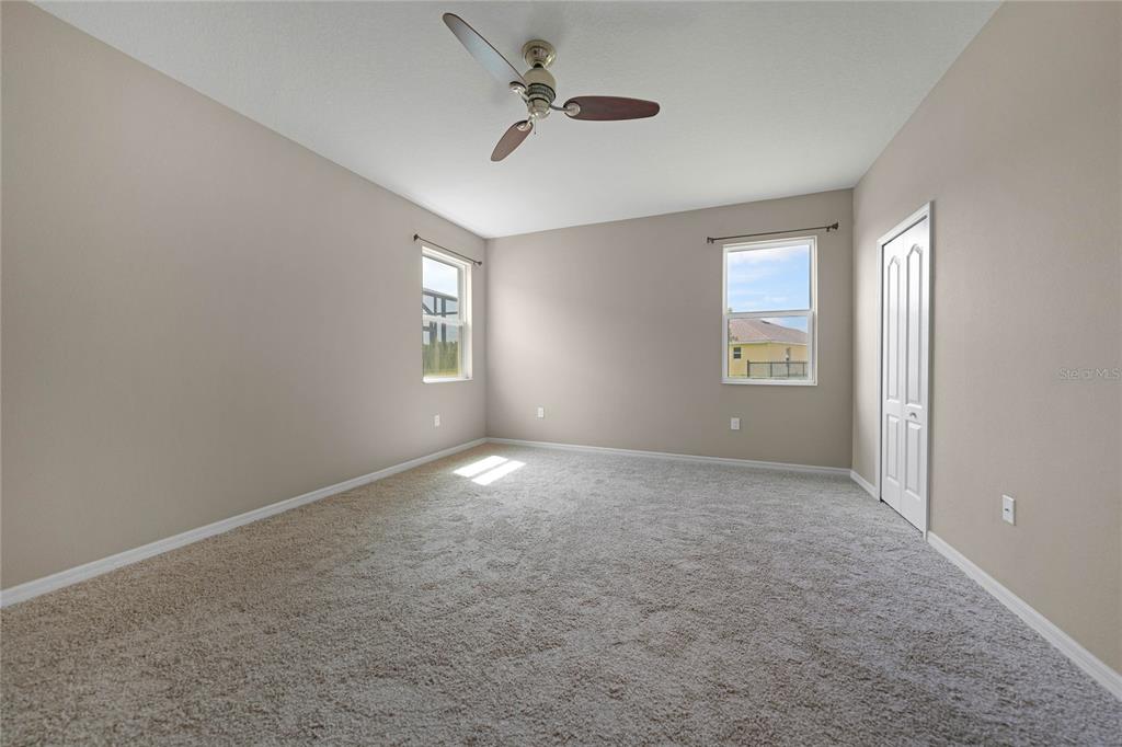 10147 Winding River Road Punta Gorda, FL 33950 - Photo 16 of 33 an empty room with windows and ceiling fan