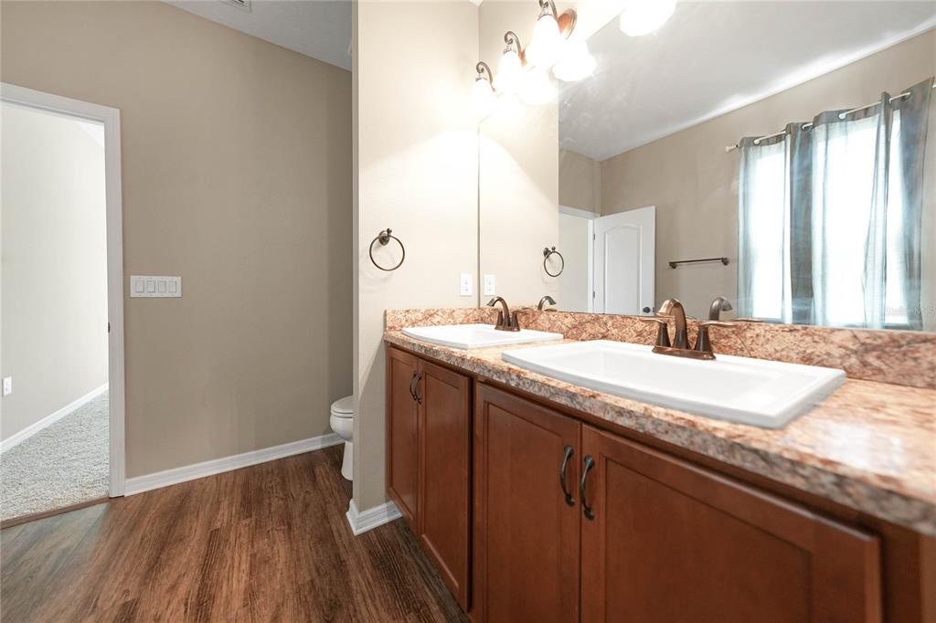 10147 Winding River Road Punta Gorda, FL 33950 - Photo 17 of 33 a bathroom with a granite countertop sink and a mirror