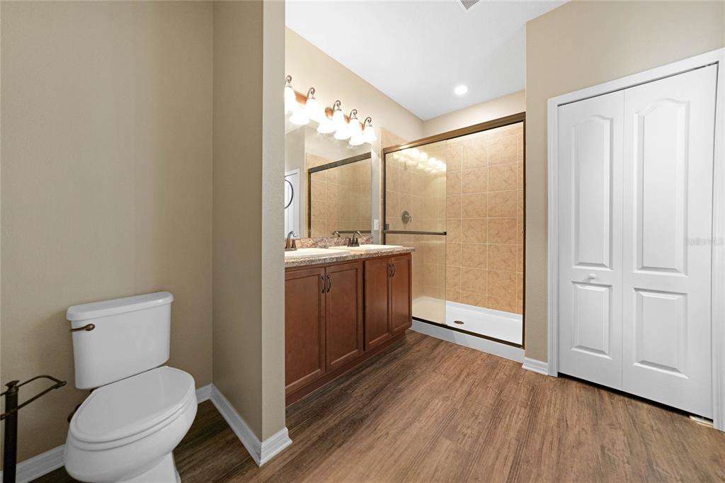 10147 Winding River Road Punta Gorda, FL 33950 - Photo 19 of 33 a spacious bathroom with a toilet sink and mirror