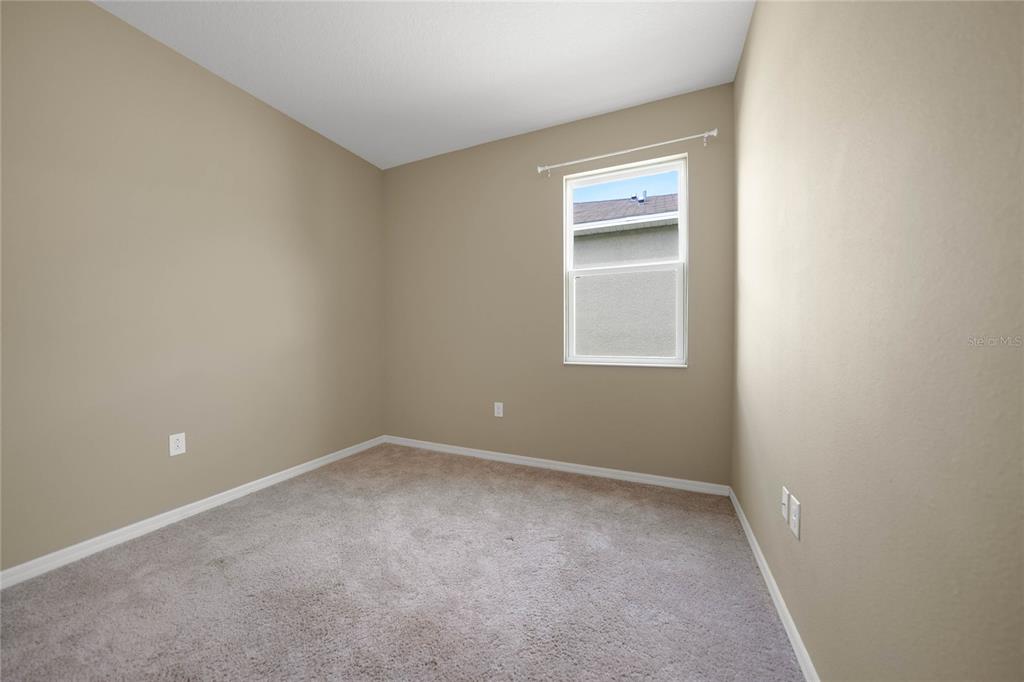 10147 Winding River Road Punta Gorda, FL 33950 - Photo 24 of 33 a view of an empty room with a window