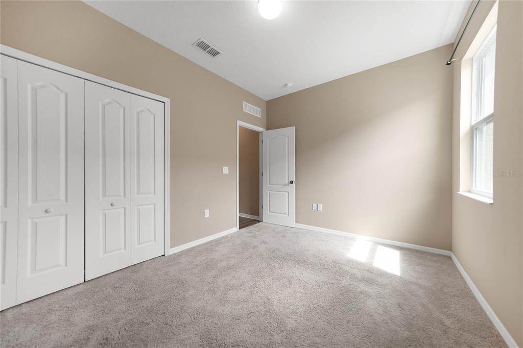 10147 Winding River Road Punta Gorda, FL 33950 - Photo 27 of 33 a view of an empty room with a window