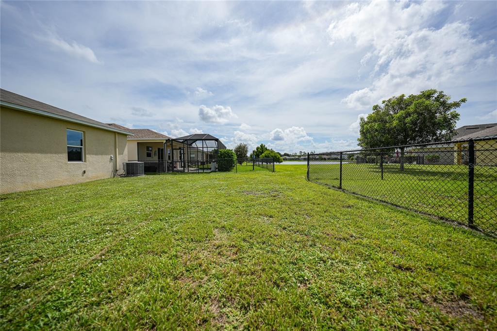 10147 Winding River Road Punta Gorda, FL 33950 - Photo 32 of 33 a view of a house with a yard