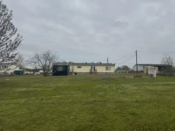 a view of a town with large trees