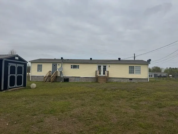 a view of a house with a back yard