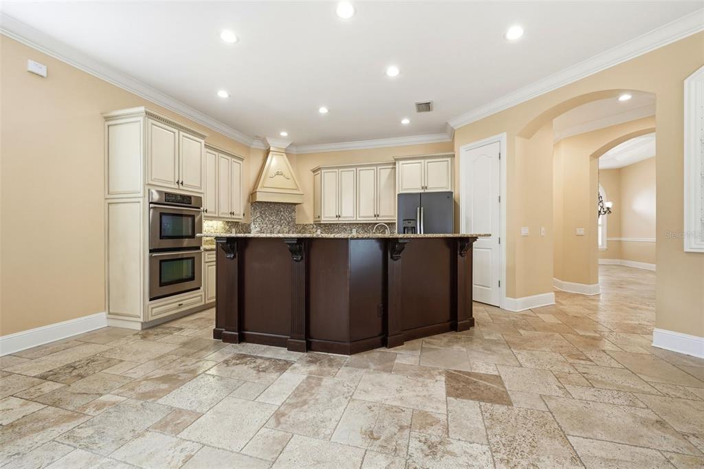 30248 Rainey Road Sorrento, FL 32776 - Photo 21 of 64 a kitchen with stainless steel appliances granite countertop a refrigerator and a sink