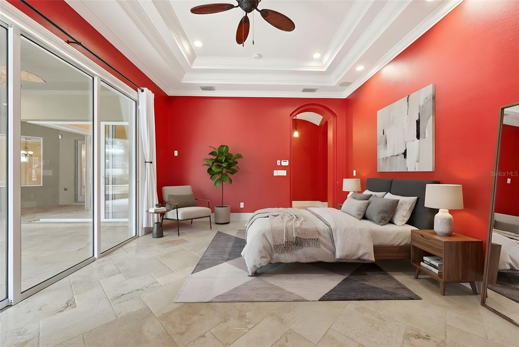 30248 Rainey Road Sorrento, FL 32776 - Photo 28 of 64 a spacious bedroom with a bed and a chandelier