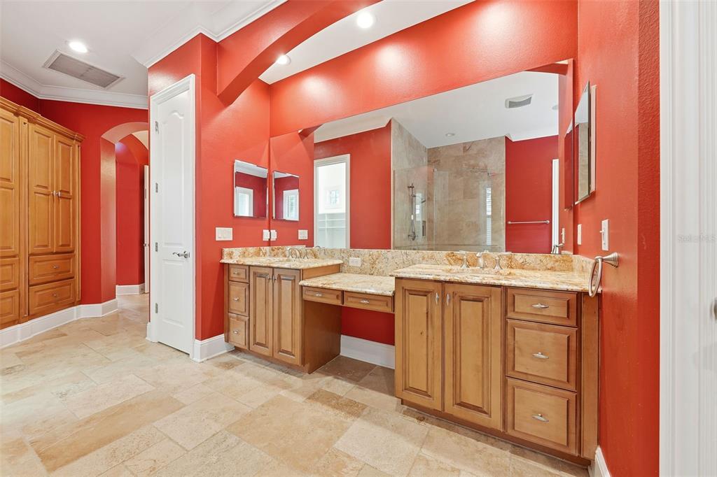 30248 Rainey Road Sorrento, FL 32776 - Photo 34 of 64 a large bathroom with a granite countertop double vanity and a mirror