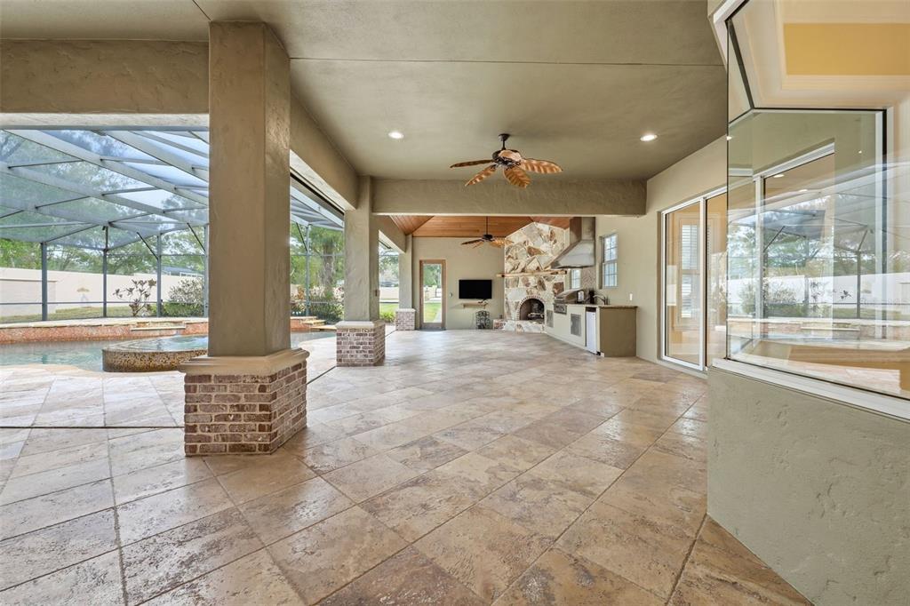 30248 Rainey Road Sorrento, FL 32776 - Photo 48 of 64 a living room with furniture a large window and chandelier