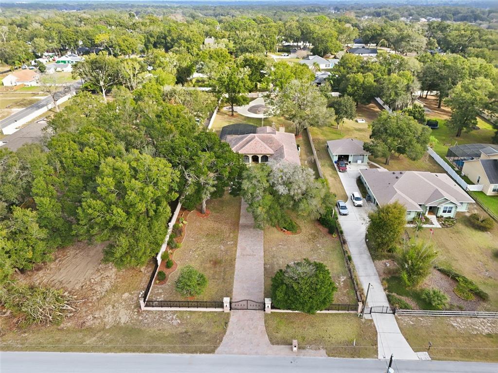 30248 Rainey Road Sorrento, FL 32776 - Photo 63 of 64 an aerial view of residential houses with outdoor space