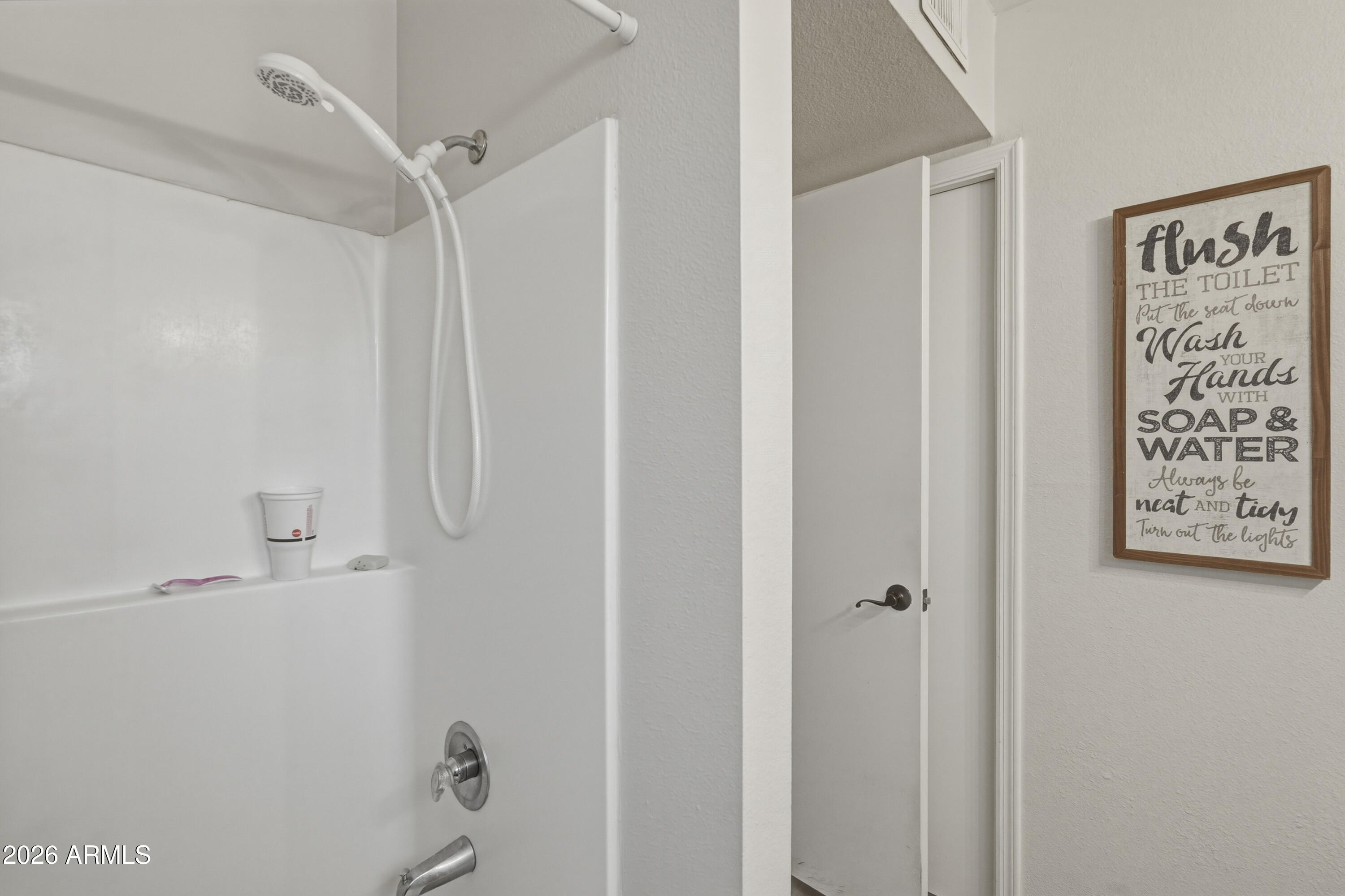 7233 West Hatcher Road Peoria, AZ 85345 - Photo 11 of 36 a bathroom with a shower and a shower