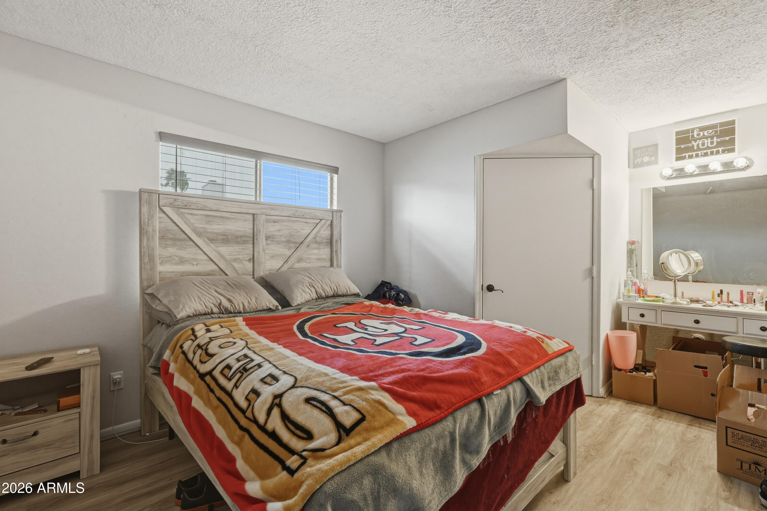 7233 West Hatcher Road Peoria, AZ 85345 - Photo 12 of 36 a bedroom with a bed and a window