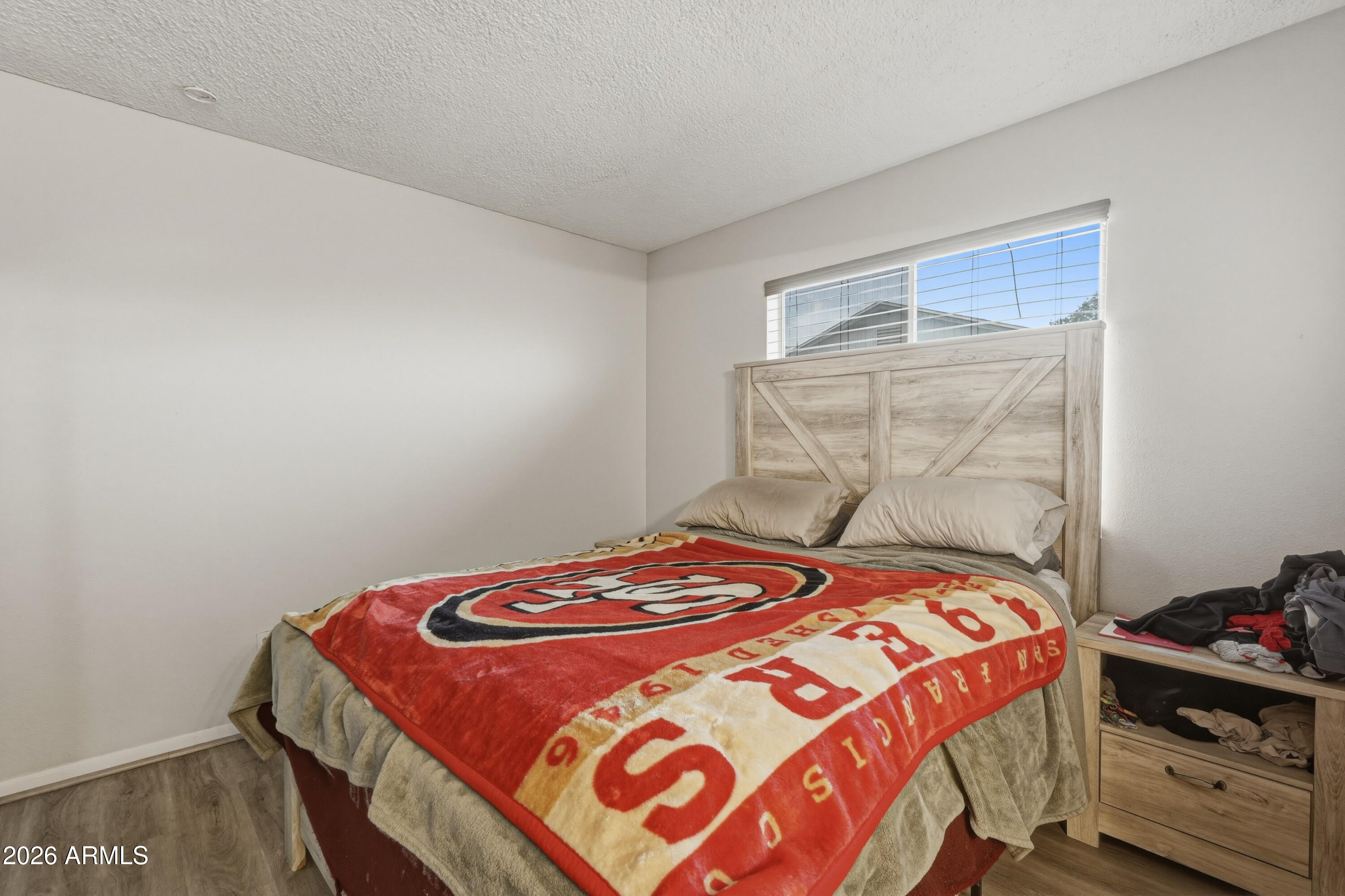 7233 West Hatcher Road Peoria, AZ 85345 - Photo 13 of 36 a bedroom with a bed and a window