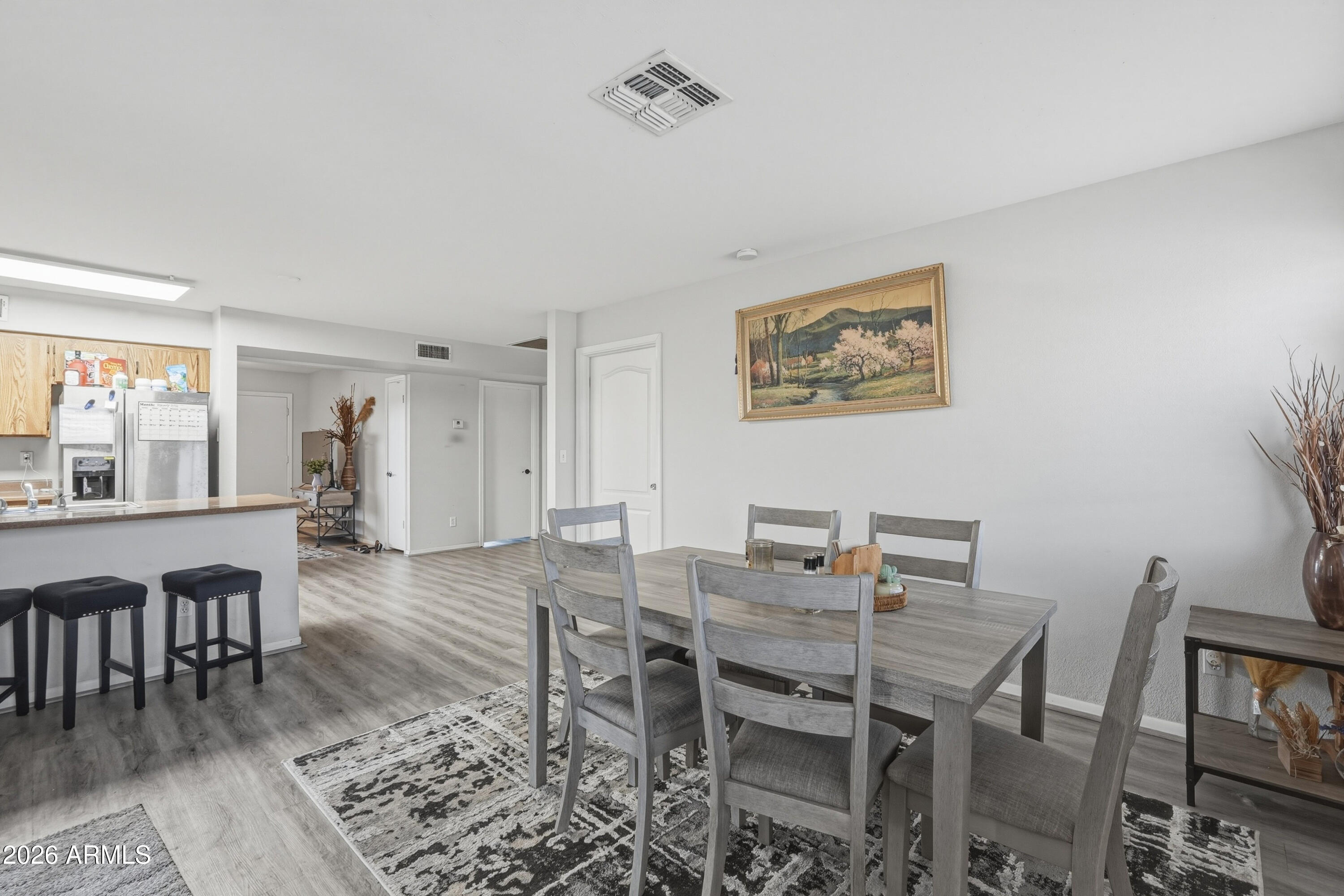 7233 West Hatcher Road Peoria, AZ 85345 - Photo 21 of 36 a view of a dining room with furniture