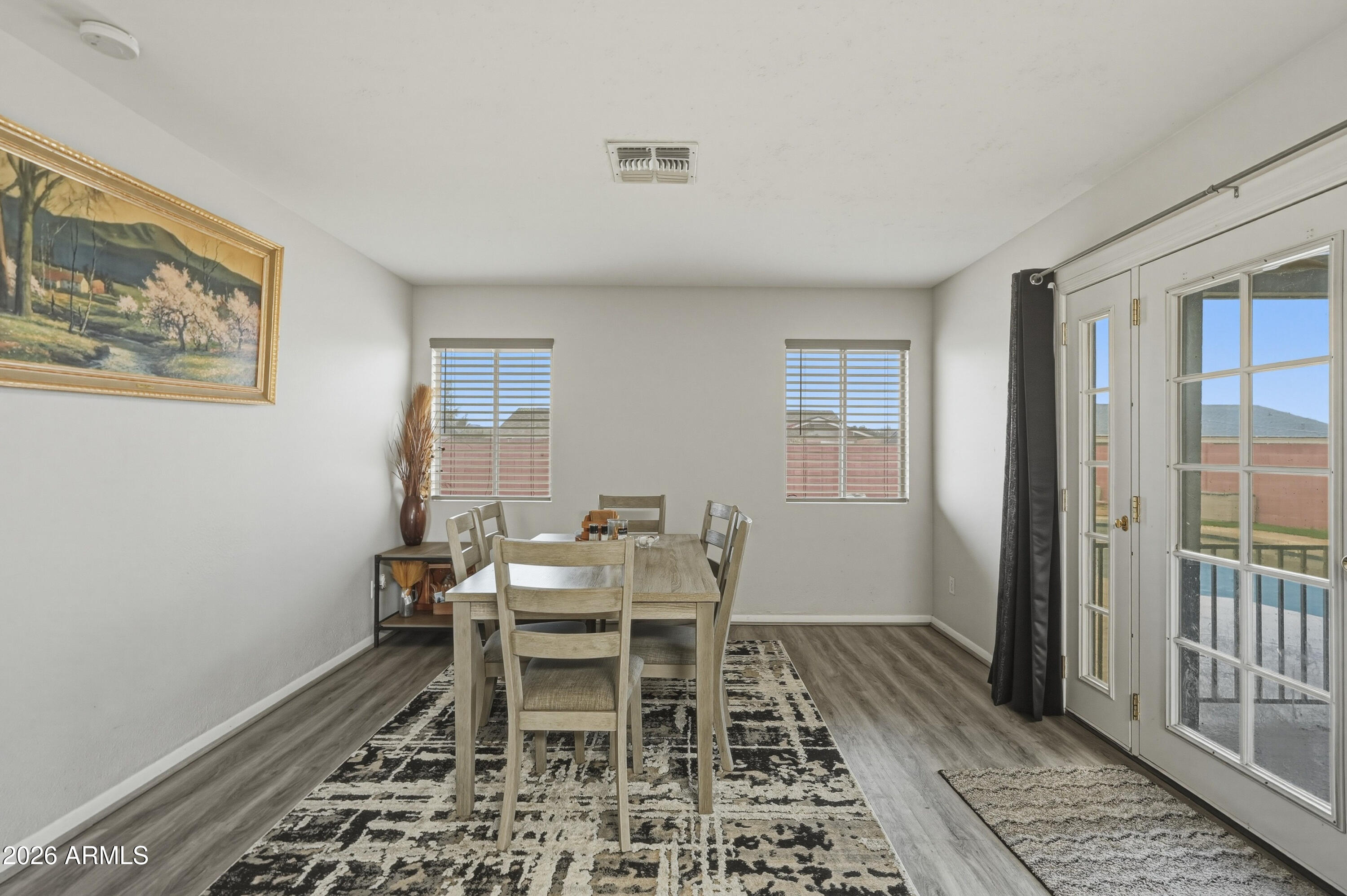 7233 West Hatcher Road Peoria, AZ 85345 - Photo 23 of 36 a dining room with a table and chair