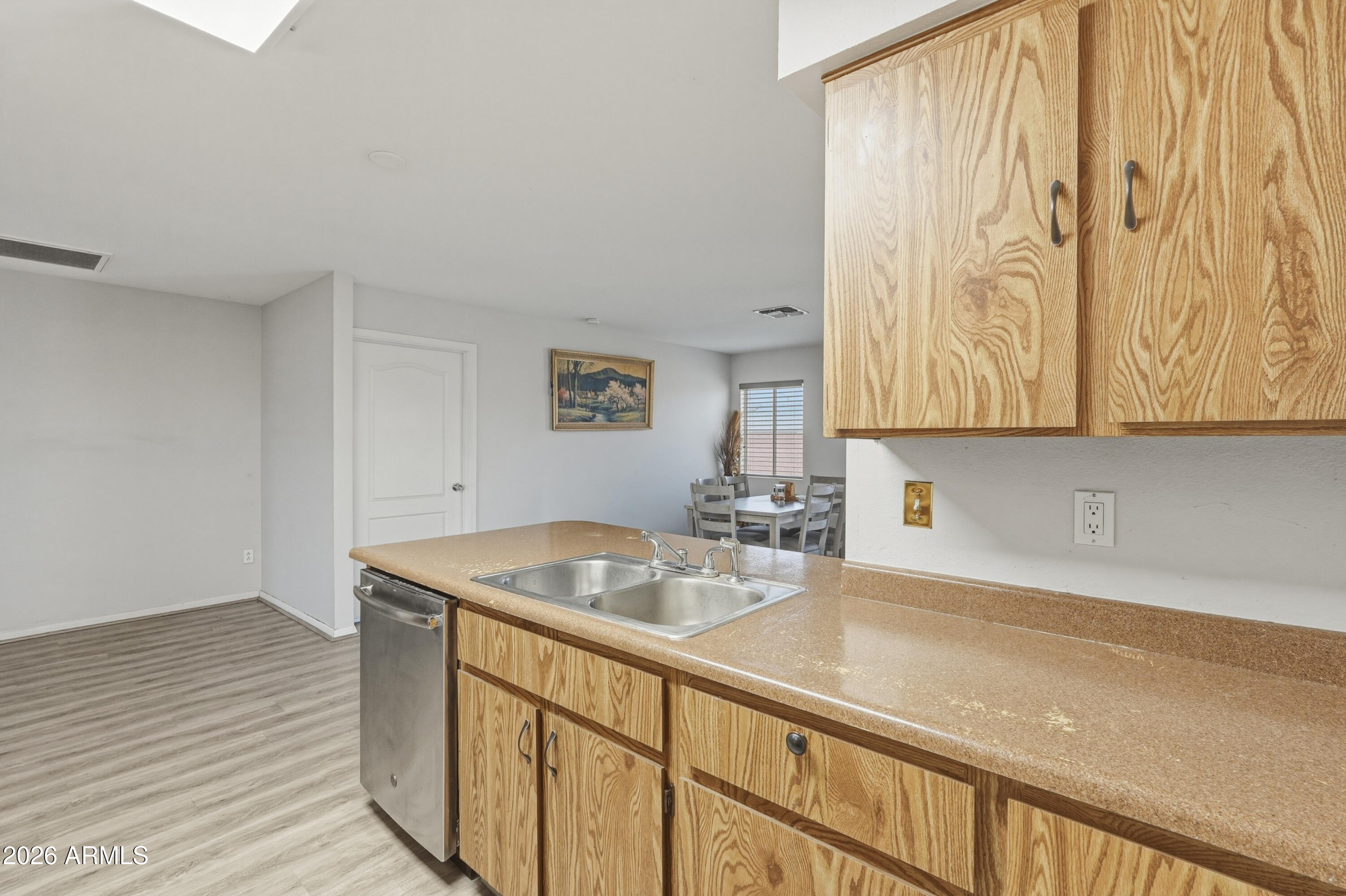 7233 West Hatcher Road Peoria, AZ 85345 - Photo 28 of 36 a kitchen with a sink and cabinets