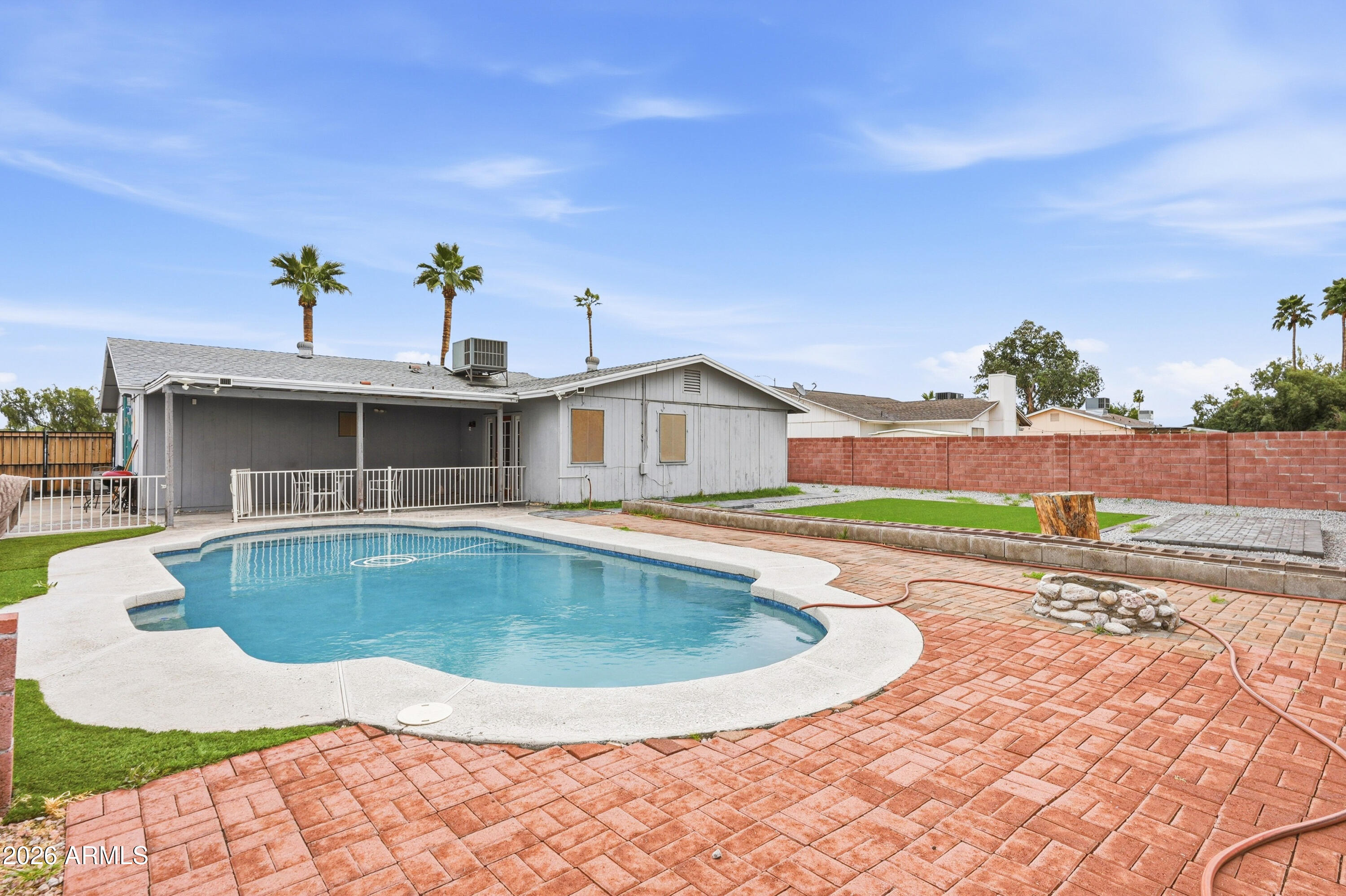 7233 West Hatcher Road Peoria, AZ 85345 - Photo 34 of 36 a view of a house with swimming pool