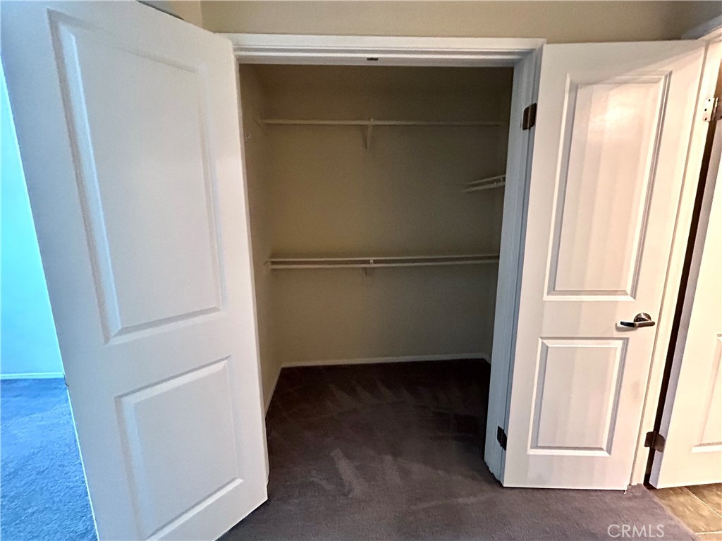 1326 Scholarship Irvine, CA 92612 - Photo 11 of 27 a view of walk in closet with empty racks