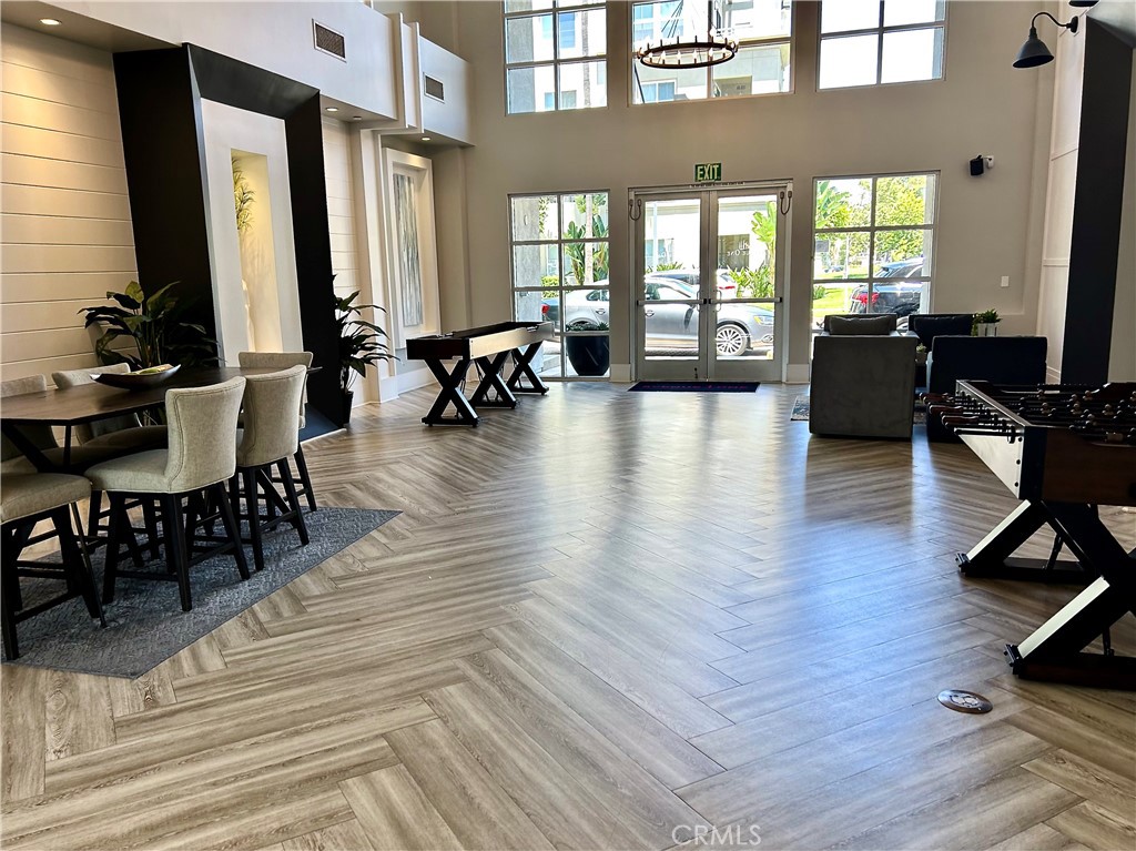 1326 Scholarship Irvine, CA 92612 - Photo 22 of 27 a living room with furniture floor to ceiling window and wooden floor
