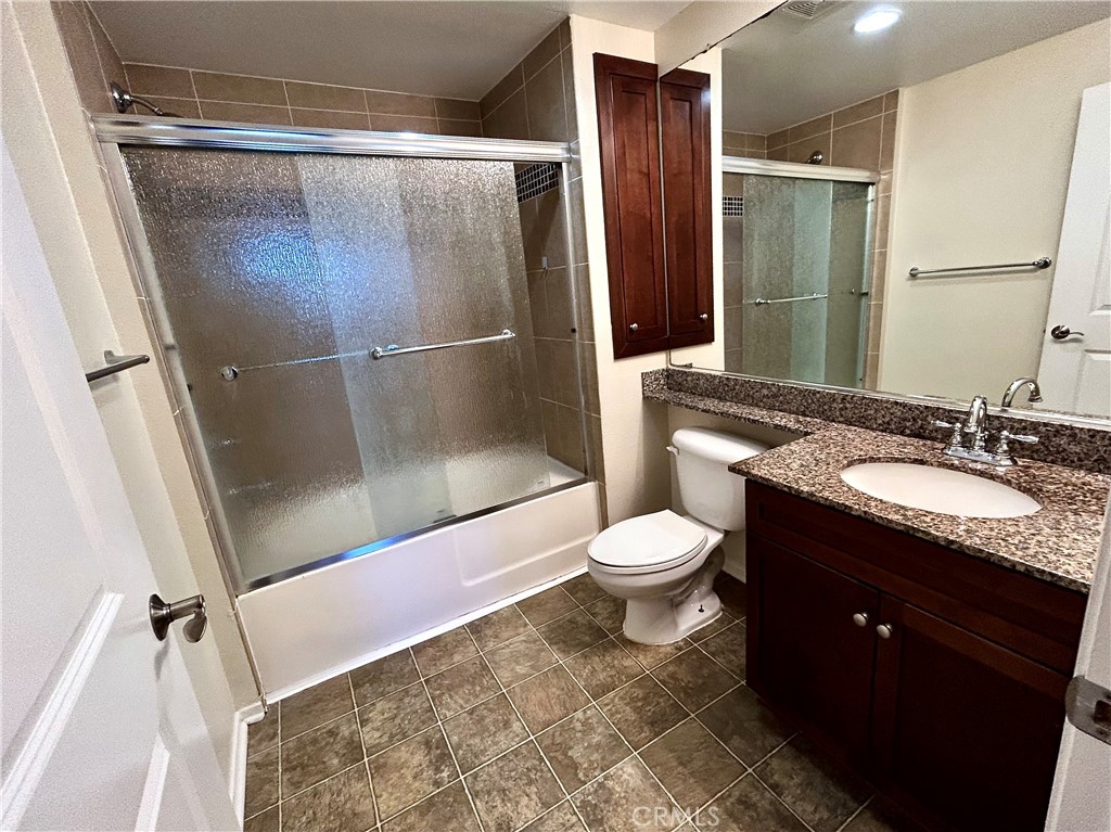 1326 Scholarship Irvine, CA 92612 - Photo 5 of 27 a bathroom with a granite countertop sink toilet and shower
