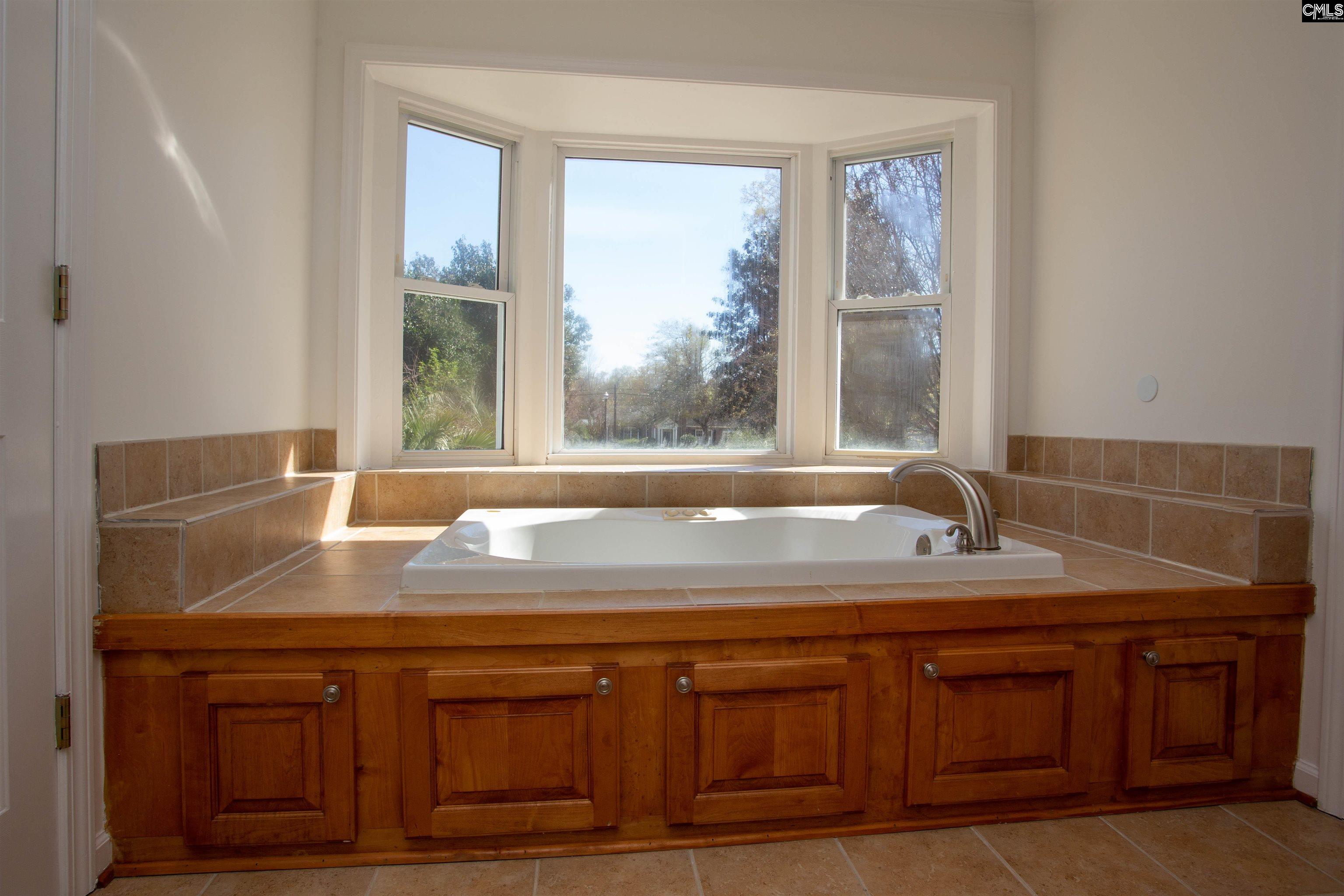 1700 Broad Street Camden, SC 29020 - Photo 29 of 41 a view of a sink a mirror and a window