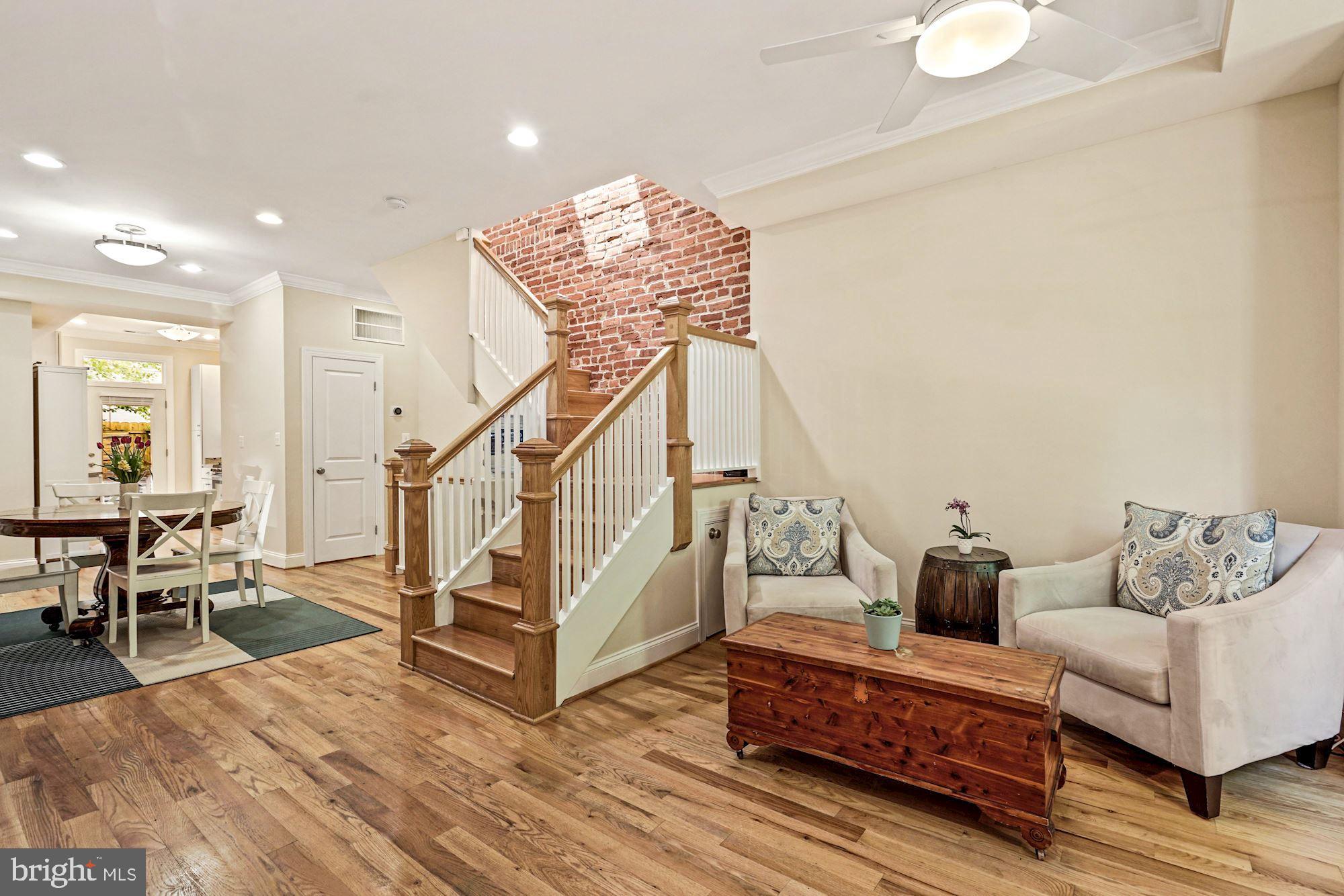 832 5th Street Northeast Washington, DC 20002 - Photo 2 of 35 a living room with furniture and wooden floor