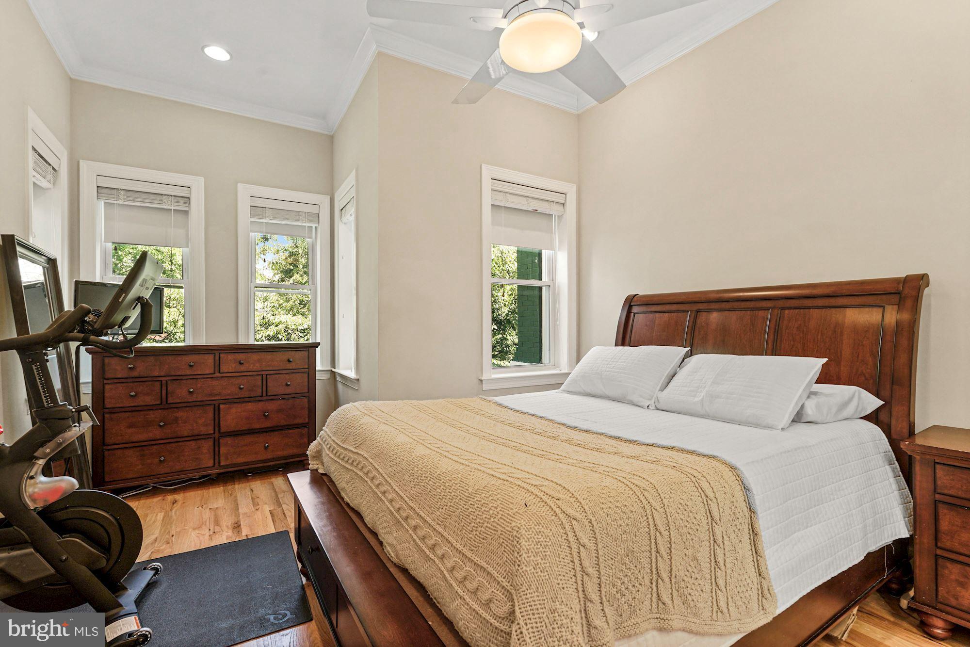 832 5th Street Northeast Washington, DC 20002 - Photo 14 of 35 a bedroom with a bed and wooden floor