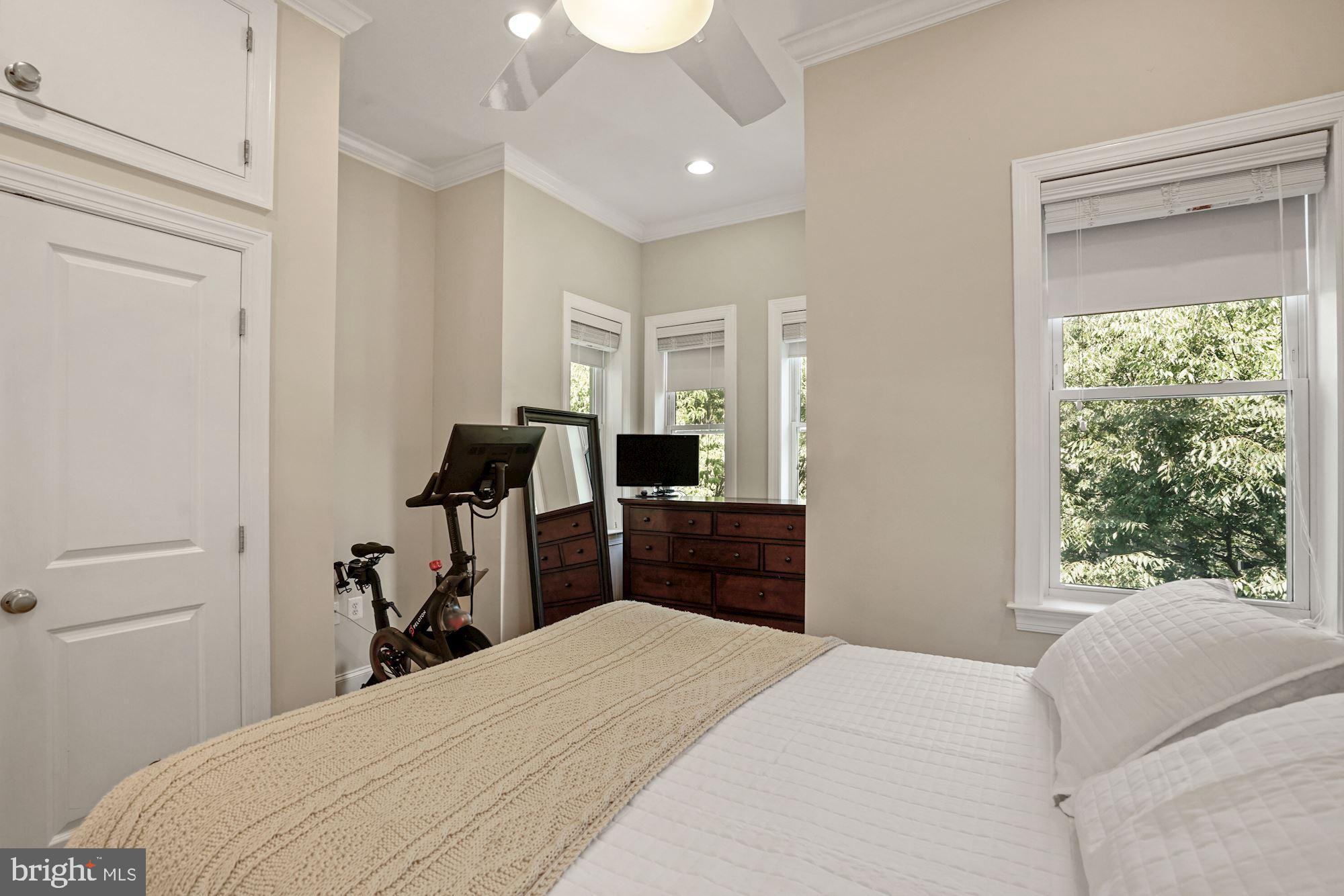 832 5th Street Northeast Washington, DC 20002 - Photo 15 of 35 a bedroom with a bed and a large window