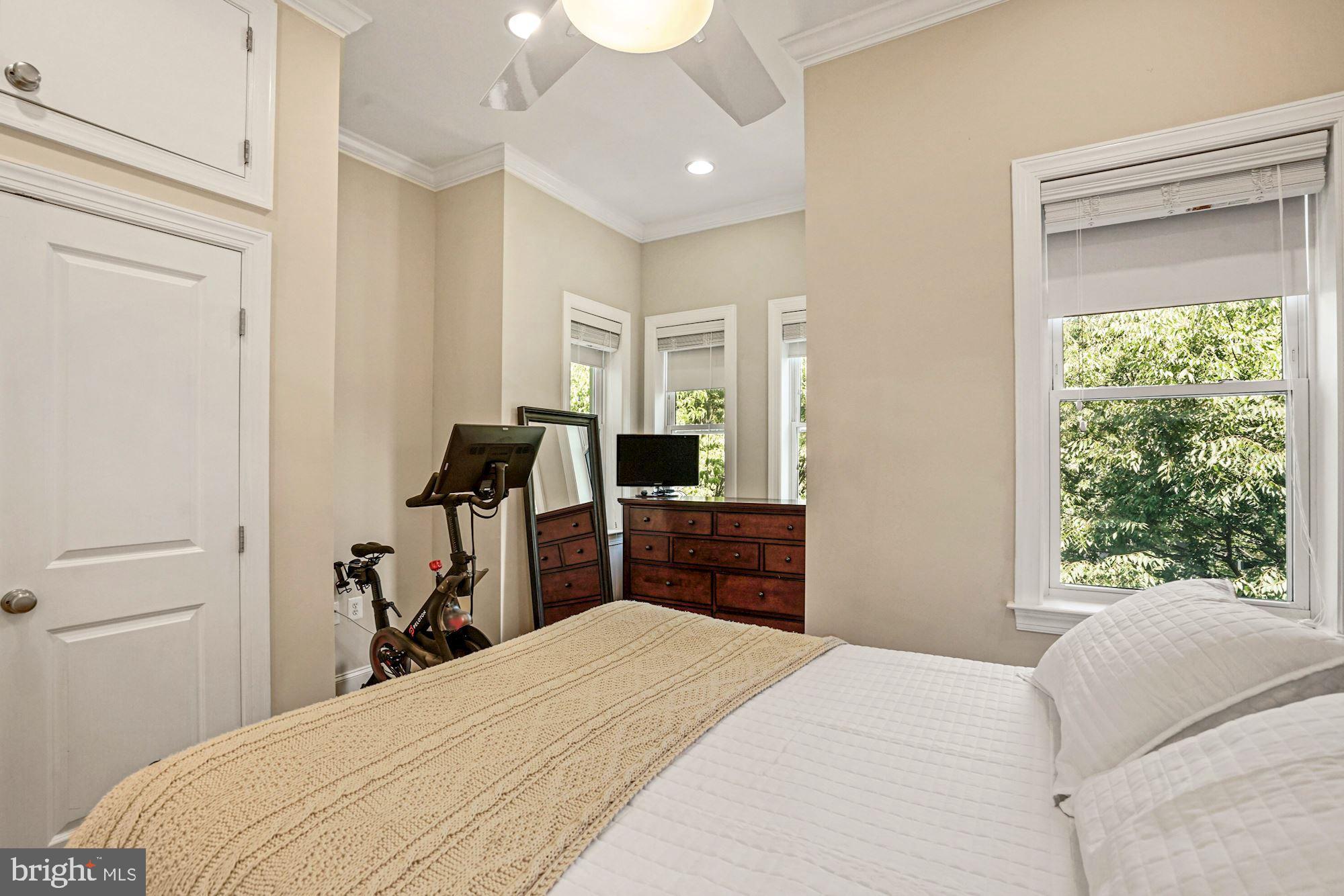 832 5th Street Northeast Washington, DC 20002 - Photo 16 of 35 a bedroom with a bed and a large window