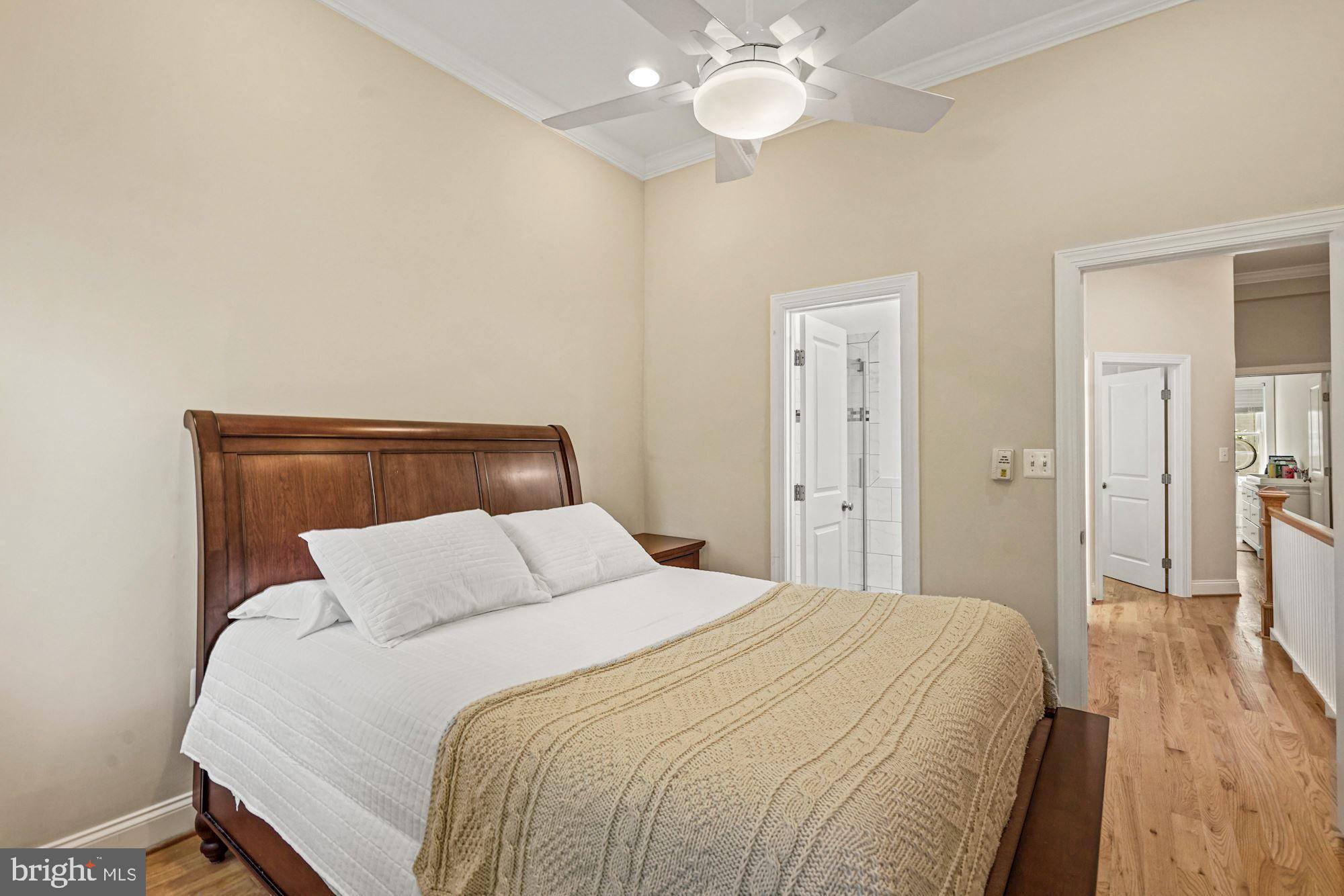 832 5th Street Northeast Washington, DC 20002 - Photo 18 of 35 a bedroom with a bed and a chandelier