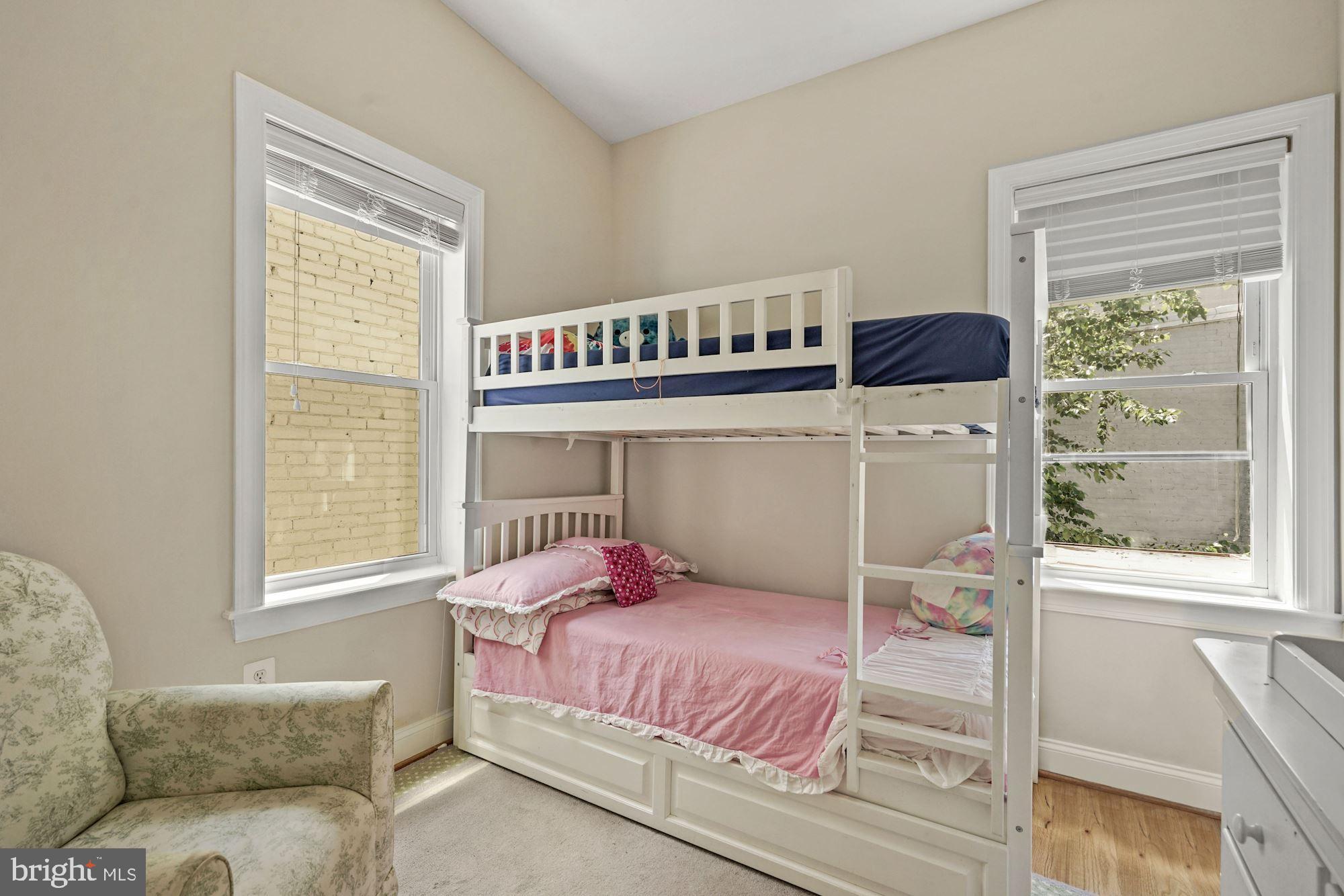 832 5th Street Northeast Washington, DC 20002 - Photo 22 of 35 a bedroom with a bed and wooden floor