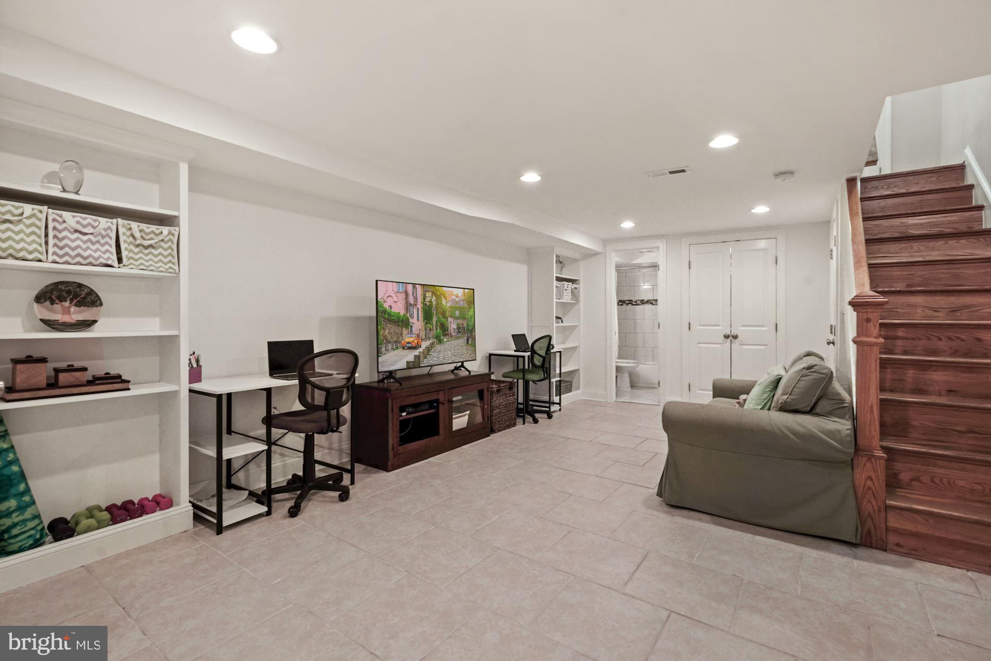 832 5th Street Northeast Washington, DC 20002 - Photo 26 of 35 a living room with furniture and a flat screen tv