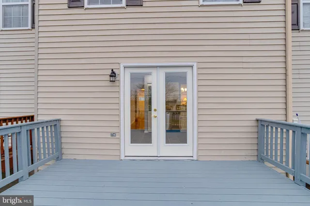 a view of a house with wooden deck