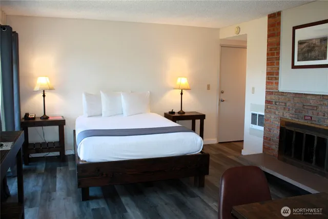 a view of a livingroom with furniture and a fireplace