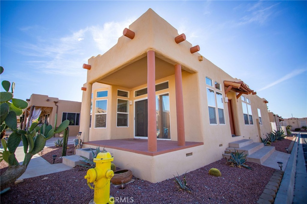 1106 Beach Drive Needles, CA 92363 - Photo 3 of 73 a front view of a house with a yard