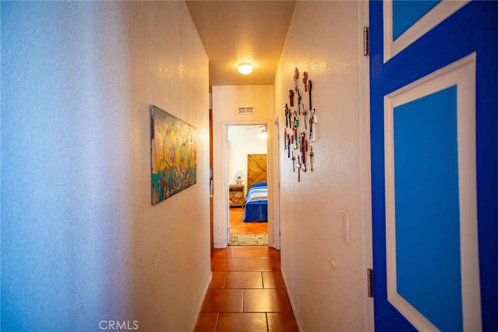 1106 Beach Drive Needles, CA 92363 - Photo 36 of 73 a view of a hallway with wooden walls and door