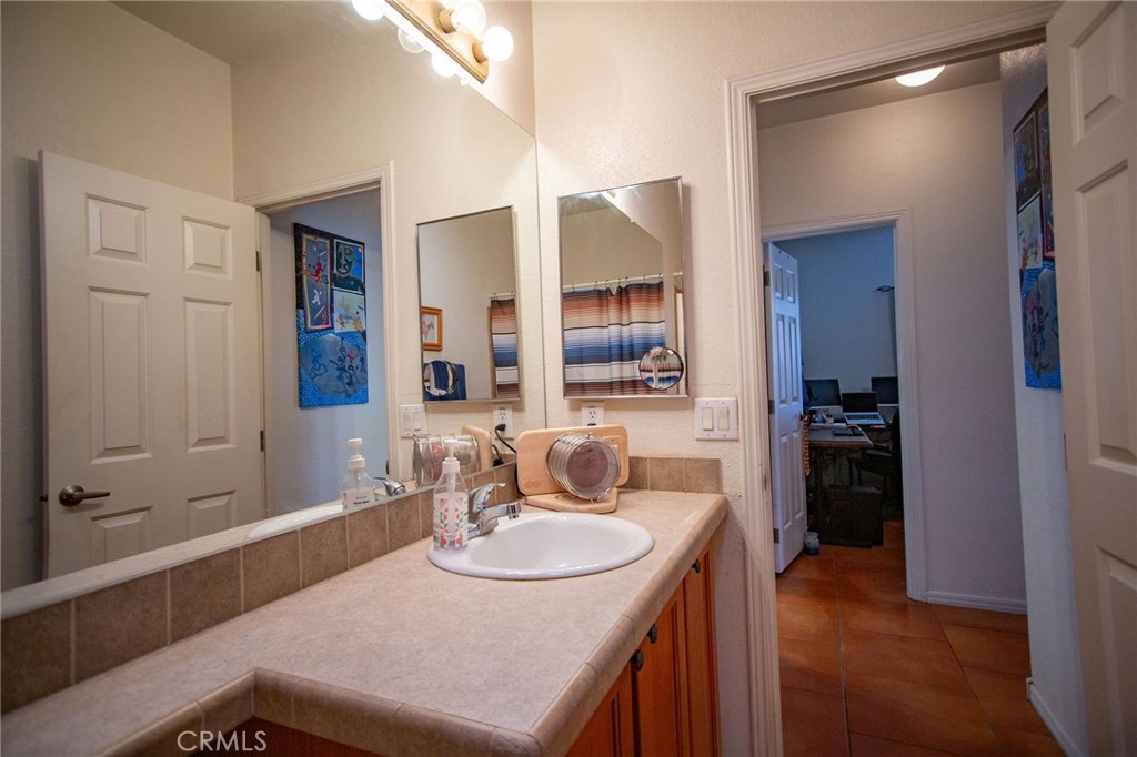 1106 Beach Drive Needles, CA 92363 - Photo 41 of 73 a kitchen with a sink and a refrigerator