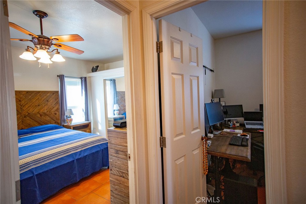 1106 Beach Drive Needles, CA 92363 - Photo 42 of 73 a kitchen view of a refrigerator and a chandelier