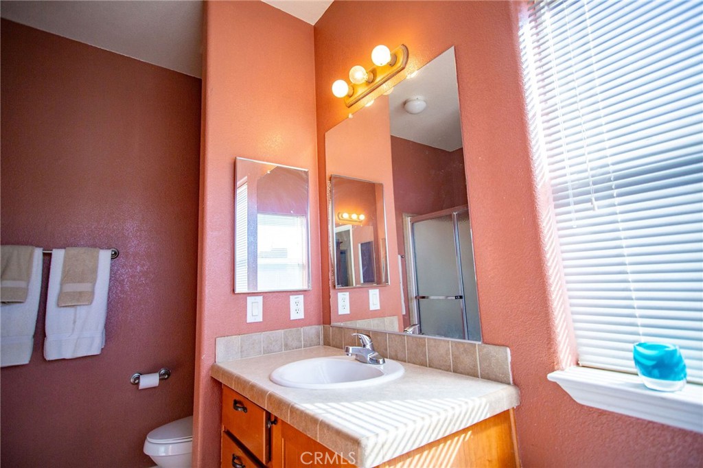 1106 Beach Drive Needles, CA 92363 - Photo 49 of 73 a bathroom with a sink and a mirror