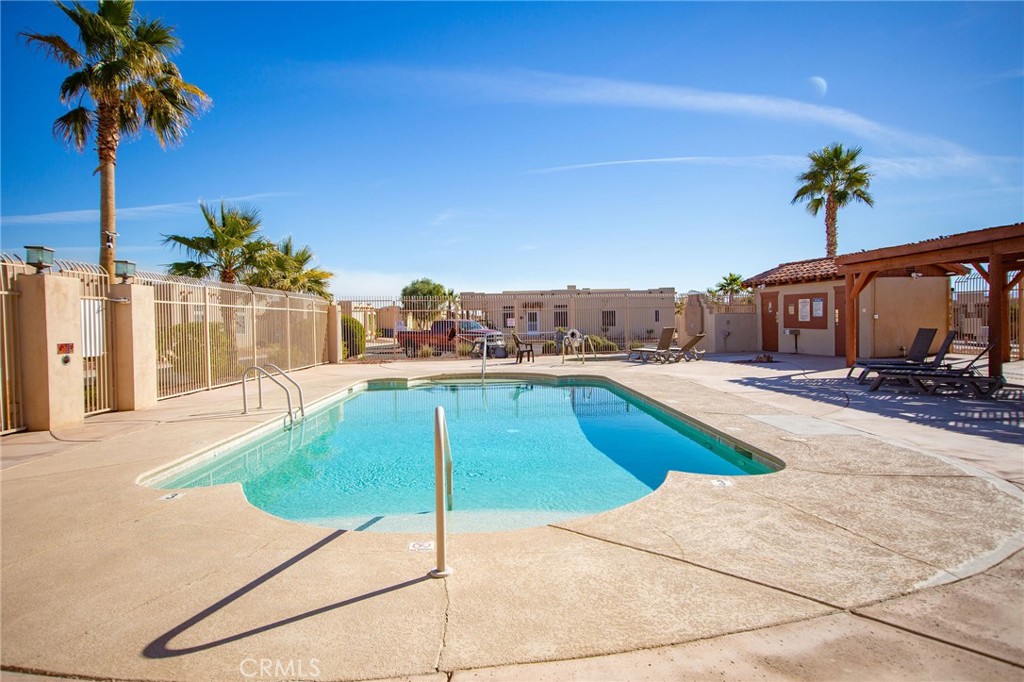 1106 Beach Drive Needles, CA 92363 - Photo 67 of 73 a swimming pool with yard