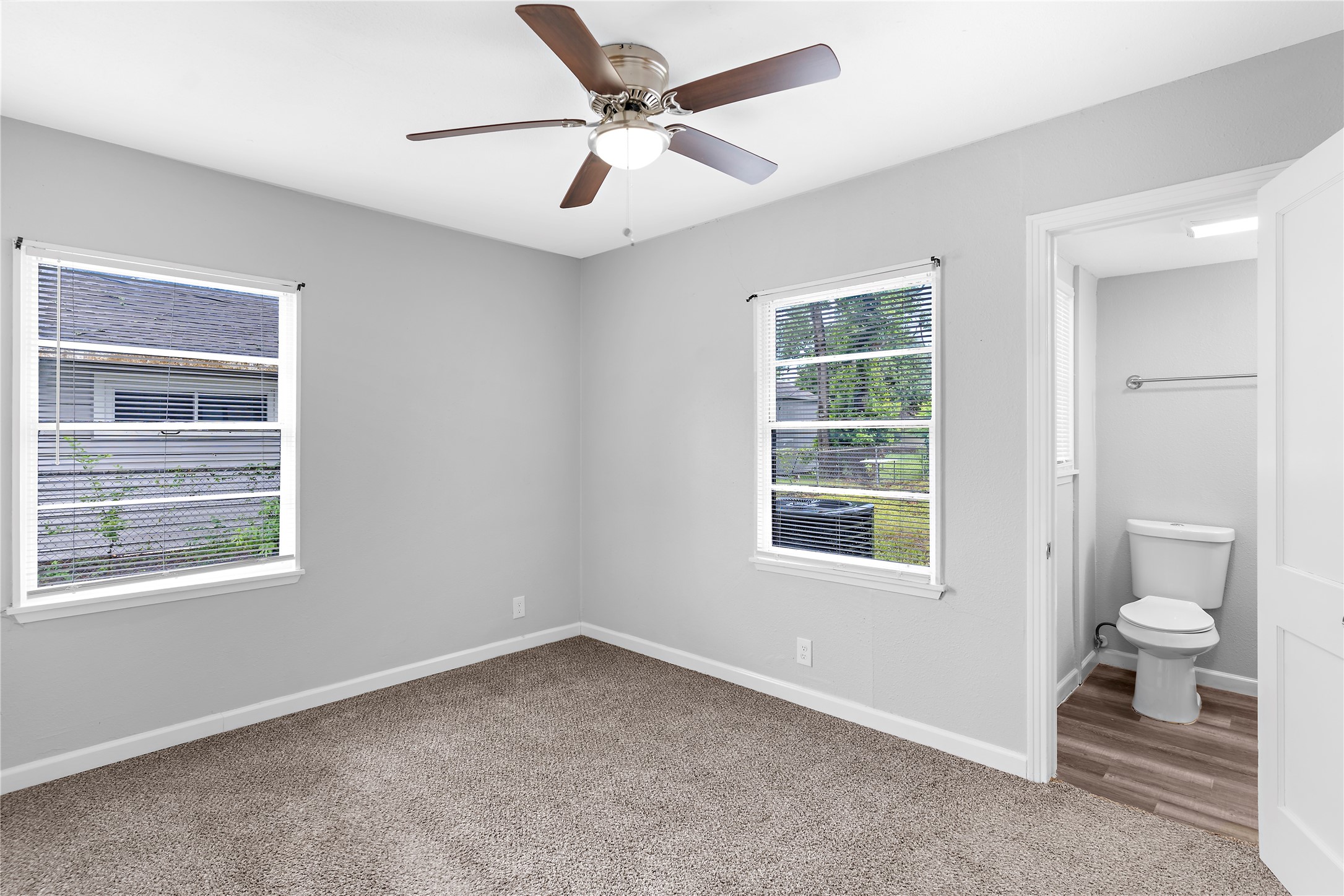 1104 Southampton Drive Angleton, TX 77515 - Photo 23 of 26 an empty room with a window and a fan
