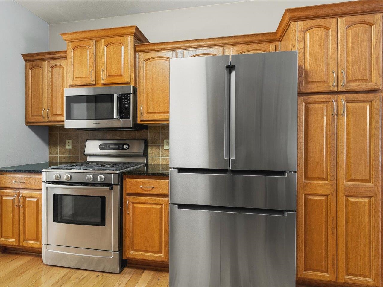 12375 Wildflower Lane Belvidere, IL 61008 - Photo 17 of 52 a white refrigerator freezer and a stove top oven