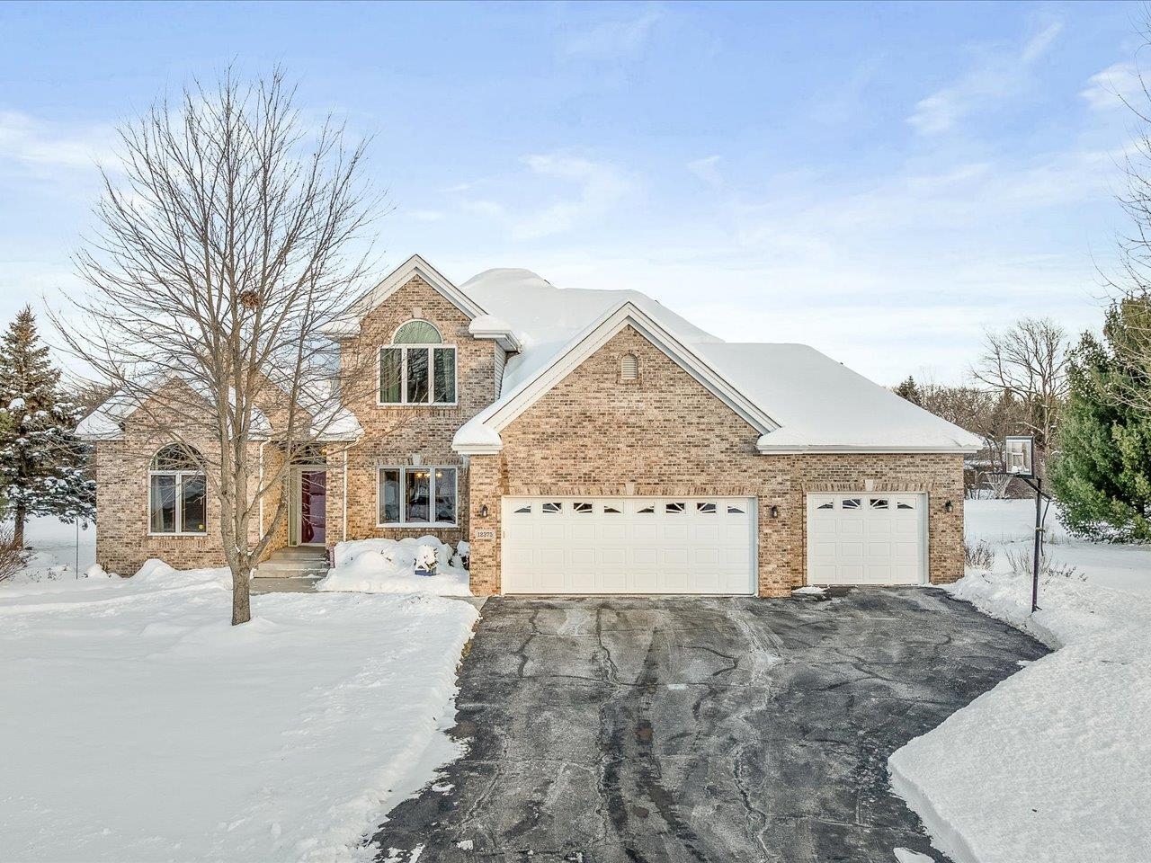 12375 Wildflower Lane Belvidere, IL 61008 - Photo 2 of 52 a front view of a house with a yard and garage