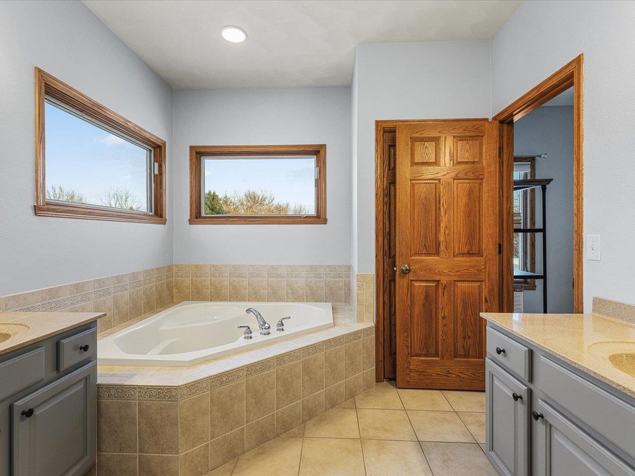 12375 Wildflower Lane Belvidere, IL 61008 - Photo 25 of 52 a bathroom with a tub sink and mirror